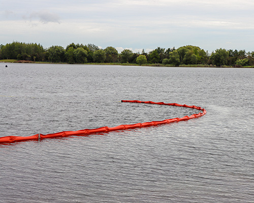 Rapid deployment booms in action on Lake Puketirini.