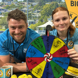 Waikato Regional Council staff with an engagement tool at the freshwater biosecurity stand