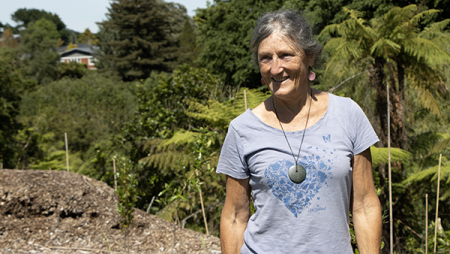 Image of a lady wearing a t shirt standing in a gully