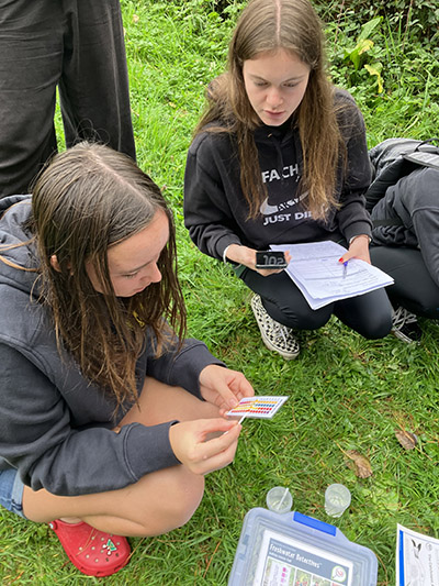Photo of students water sampling