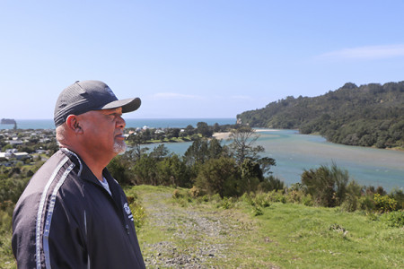 Errol Gilbert overlooking the river mouth and land block