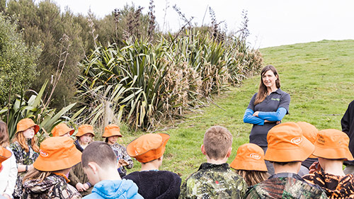 Bexie teaching students from Puahue School about Taiea te Taiao.