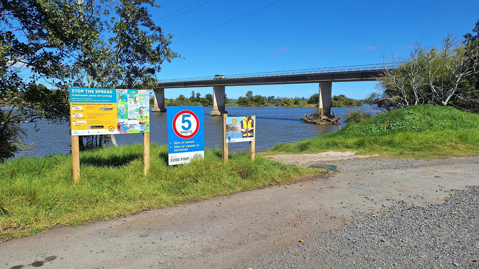 Boat ramp with signage showing freshwater species information